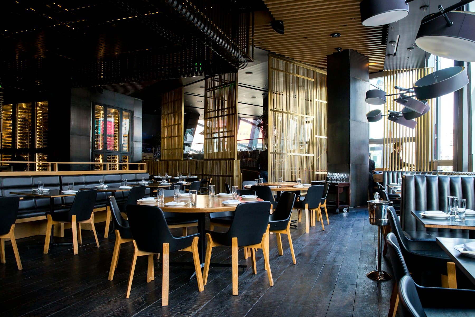 A warmly lit London restaurant dining room